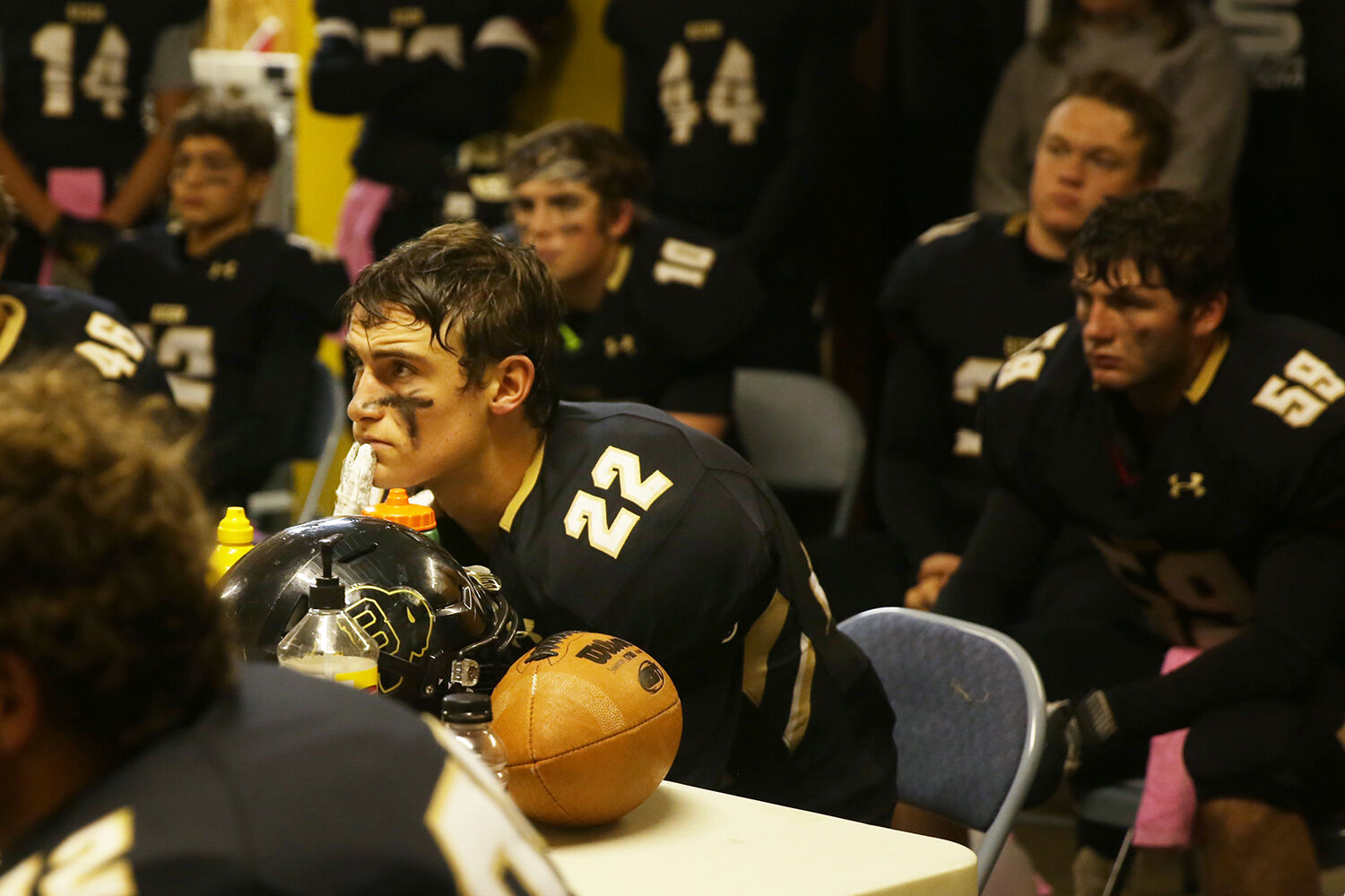 Blake Bell sits amidst the team inside the shed